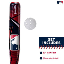 Close-up of red and black youth baseball bat with white practice ball