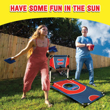 Cornhole shootout set on grass with blue board and hoop net, with bean bags