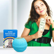 Blue bath bomb with gold design held near a cash bill by a woman