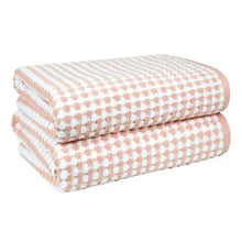 2-piece bath towel set, two folded pink towels with dot-check weave