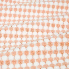 2-piece bath towel set in pink with dot-check woven texture, close-up