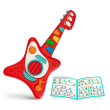 Red toy guitar with colored keys, speaker panel, and blue songbook