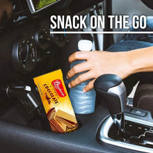 Wafer chocolate stick pack beside a drink bottle, Bauducco Wafer snack