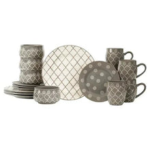 Gray dinnerware set with plates, mugs, bowls, and napkin holder pieces in patterns