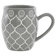 Gray patterned mug with white quatrefoil and dot medallion motifs, curved handle