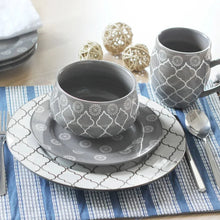Gray and white geometric dinnerware set with bowl, plates, mugs, and spoon