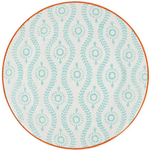 White dinner plate with teal medallion pattern and orange outer rim.