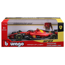 Die-cast Formula car model in retail box, red and black with yellow accents and driver figure
