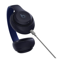 Navy over-ear headphones with 3.5 mm cable connection and cushioned ear pads