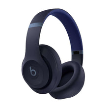 Navy over-ear headphones with padded ear cups and visible circular ear logo