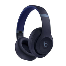 Navy over-ear wireless headphones, angled view with cushioned ear pads