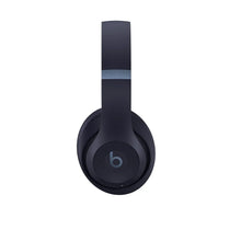 Beats Studio Pro wireless headphones in navy, over-ear with round earcup design