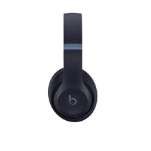 Black over-ear headphones with cushioned headband and circular ear cup logo