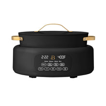 Black electric multi-cooker with lid and gold-tone handles, front control display