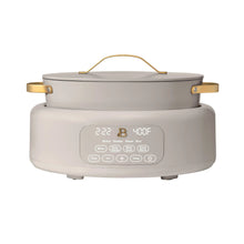 Electric multi-cooker with lid and front control panel, cream body with gold accents