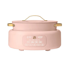 Electric multi-cooker with lid and front control panel, pink body with gold accents