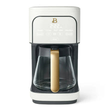 White 12-cup programmable coffee maker with clear carafe and gold-tone handle