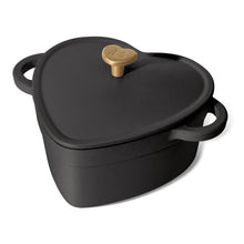 Black cast iron heart Dutch oven with domed lid and gold knob, side handles