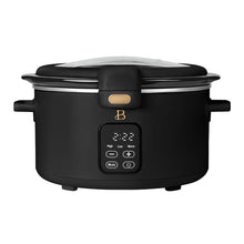 Black 4-quart digital slow cooker with a hinged locking glass lid and front control panel