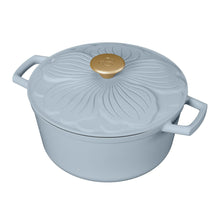 Cornflower blue enameled cast iron round Dutch oven with petal lid, gold knob, side handles