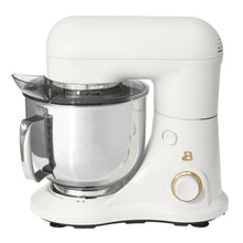 White stand mixer with stainless bowl and flat beater attachment