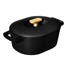 Black enamel Dutch oven with lid and gold knob, side handles