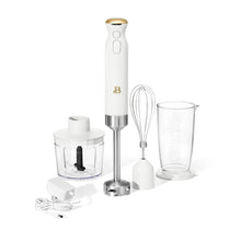 Cordless immersion blender in white icing with whisk, chopper, and measuring cup