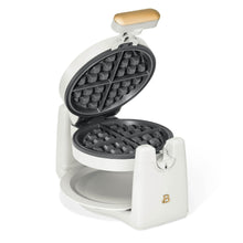 Rotating Belgian waffle maker by Drew Barrymore, white with open lid and dark plates