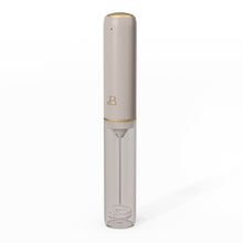 Taupe rechargeable milk frother stored in its clear protective case