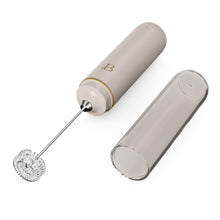 Rechargeable milk frother with whisk and translucent storage case in taupe