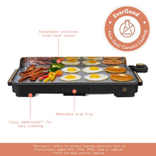 Beautiful XL electric griddle in black with food, stainless steel splash guard, and removable drip tray