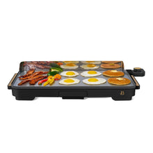 XL electric griddle cooking eggs, bacon, peppers and pancakes on its wide surface