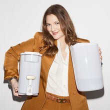 Beautiful by PUR water filter dispenser held beside its removable reservoir