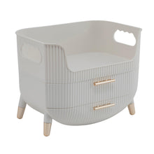 White beauty organizer with three ribbed storage drawers and gold-tone handles