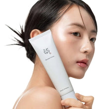 Beauty of Joseon Dynasty Cream tube held by model