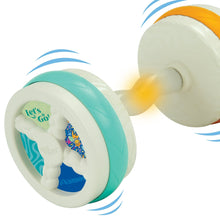 Bouncy barbell baby toy in teal and white with motion blur on rollers