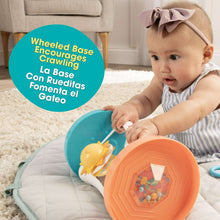 Baby holding activity mirror, orange base with teal side and yellow sun toy