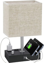Fabric-shade bedside lamp with black charging base, USB-C and phone charging ports