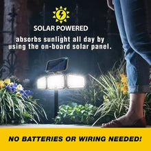 Solar powered floodlight with three LED panels mounted on a stake for outdoor light