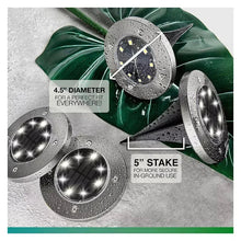 Solar disk lights with stainless-steel LED faces and ground stakes, multiple lights shown