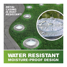 Bronze solar disk lights on lawn, metal casing for weather resistance