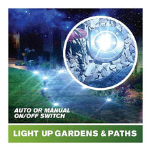 Bronze solar disk lights glowing along a path with on/off switch control