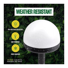 White dome solar LED pathway light with rain droplets on stake