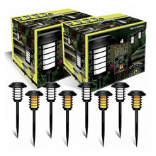 Black solar pathway stake lights with lantern heads shown in a retail box set.