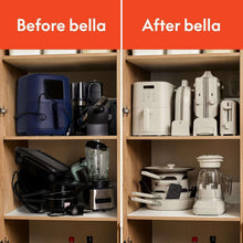 Toaster and other small appliances arranged in kitchen cabinet shelves