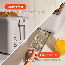 Gray 4-slice slim toaster with crumb tray pulled out for cleaning