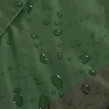 Green water-repellent fabric with visible droplets, textured weave