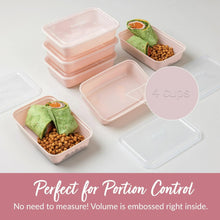 Pink meal prep container set with lids, portioned servings on a flat surface