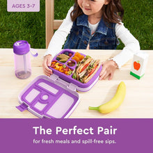 Kids lunch box with divided compartments and purple water bottle set, open on table.