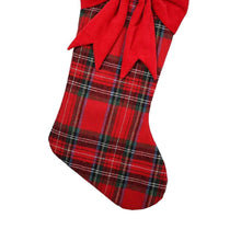 Red plaid Christmas stocking with hanging loop and large red bow